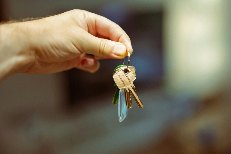 New homeowner holding house keys — the moment first-time buyers in Bothell work toward