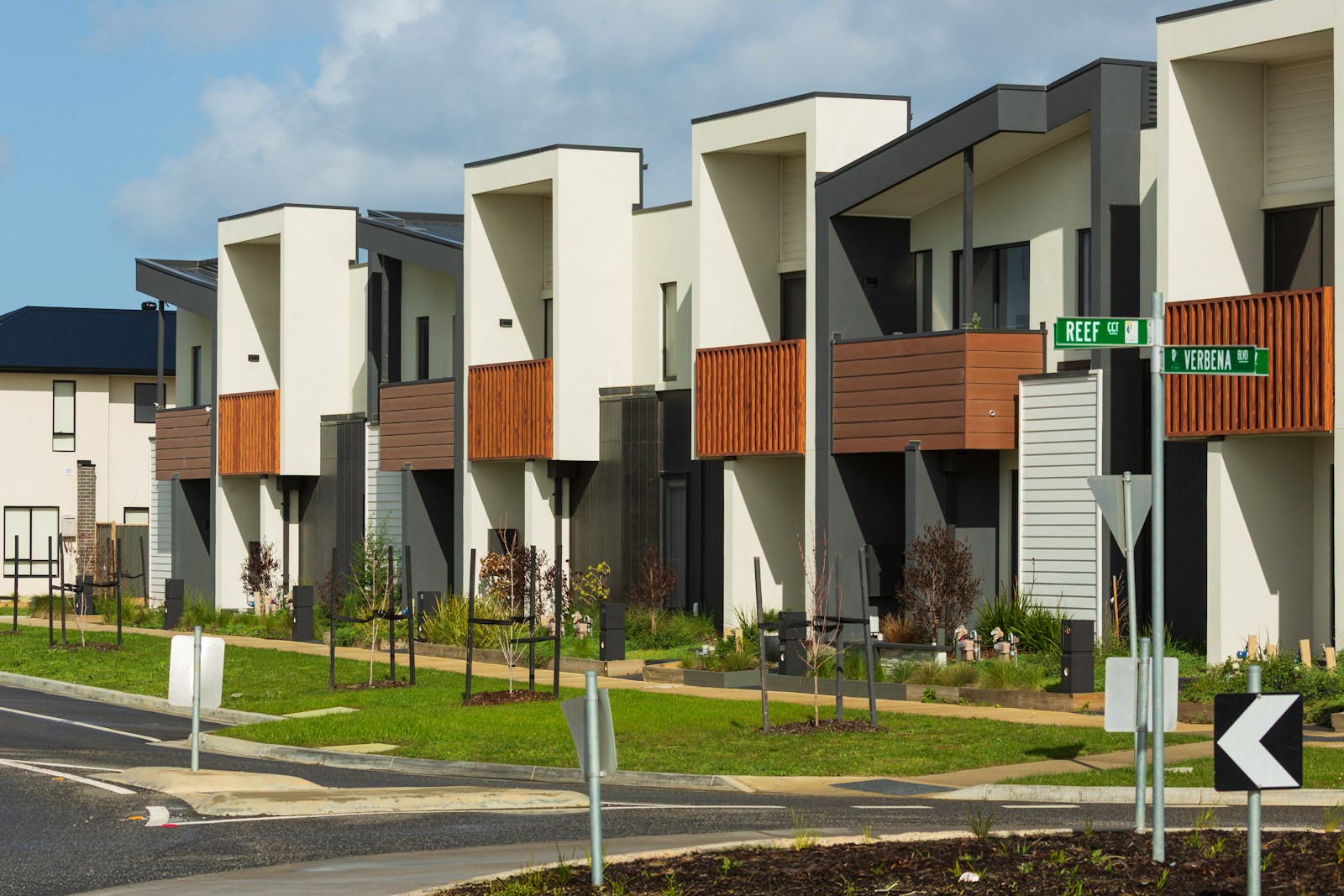 Row of new construction townhomes replacing single houses in a Seattle-area neighborhood