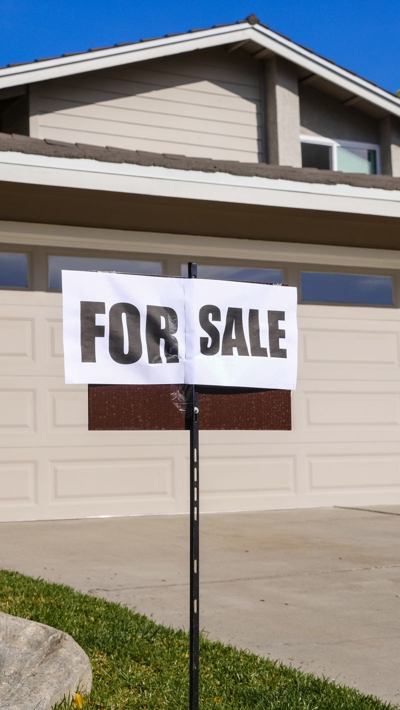 For sale sign in front of a suburban King County home during the summer 2026 buyer slowdown