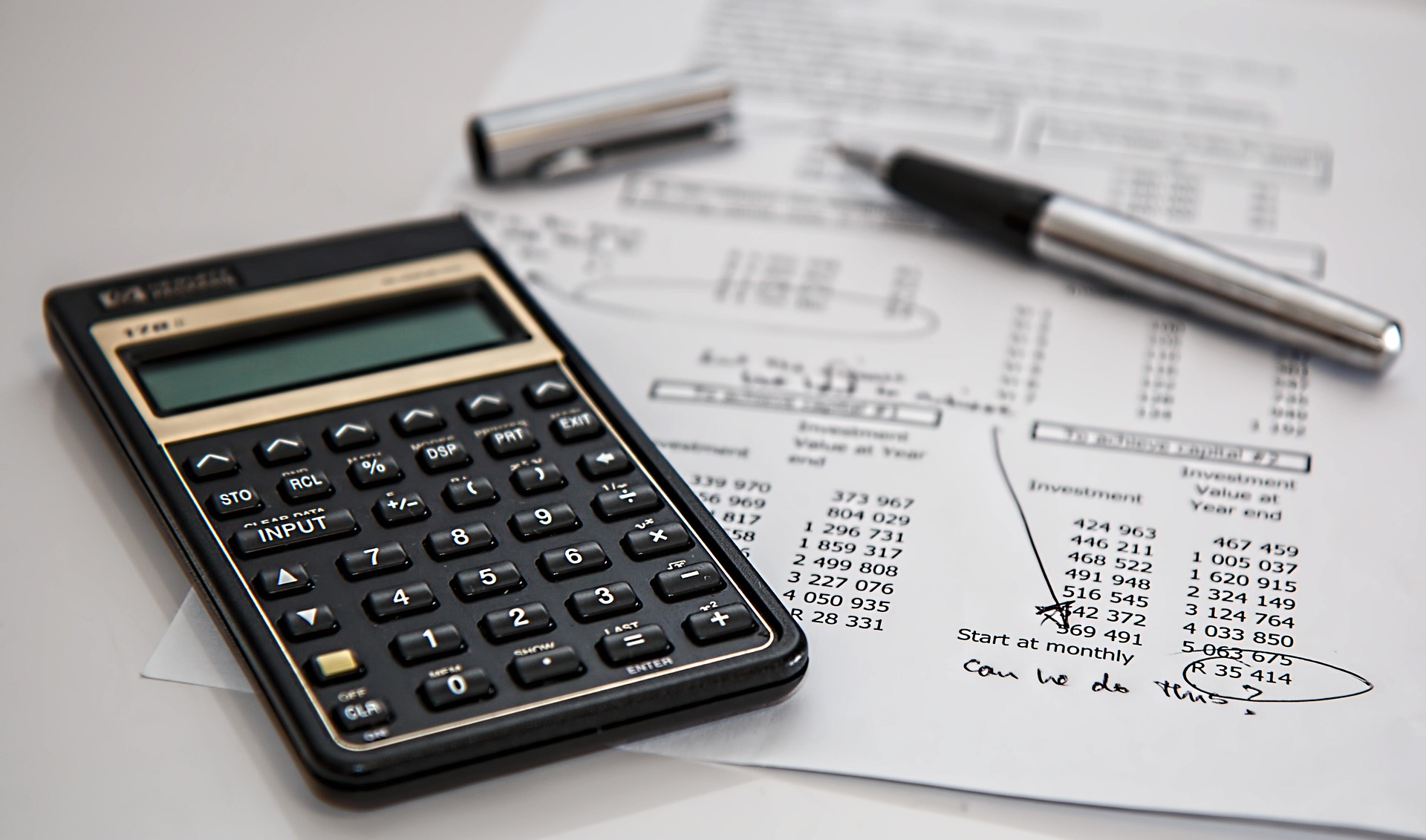 Calculator and notepad used to run monthly payment numbers before buying a Seattle home
